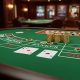 High-angle view of a Baccarat table with cards showing a Banker win, and a stack of chips on the Banker bet area, symbolizing the strategic advantage in online Baccarat.
